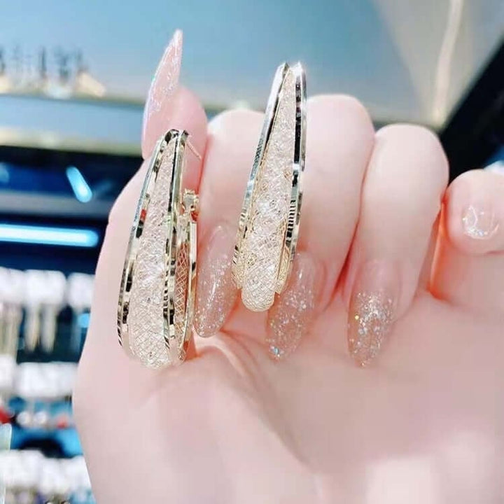 Ressa - Csavart ovális karika fülbevalók