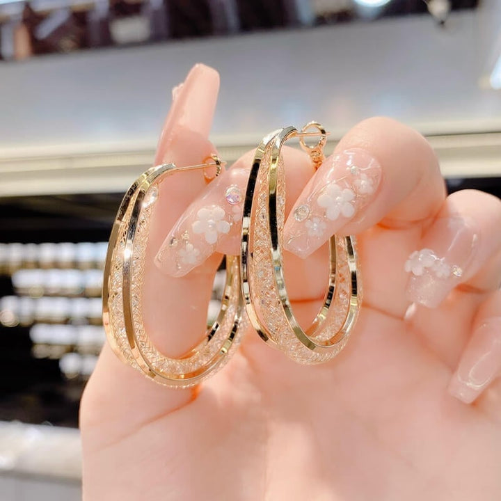 Ressa - Csavart ovális karika fülbevalók